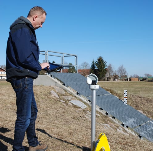 man connecting via bluetooth to a water level monitoring system